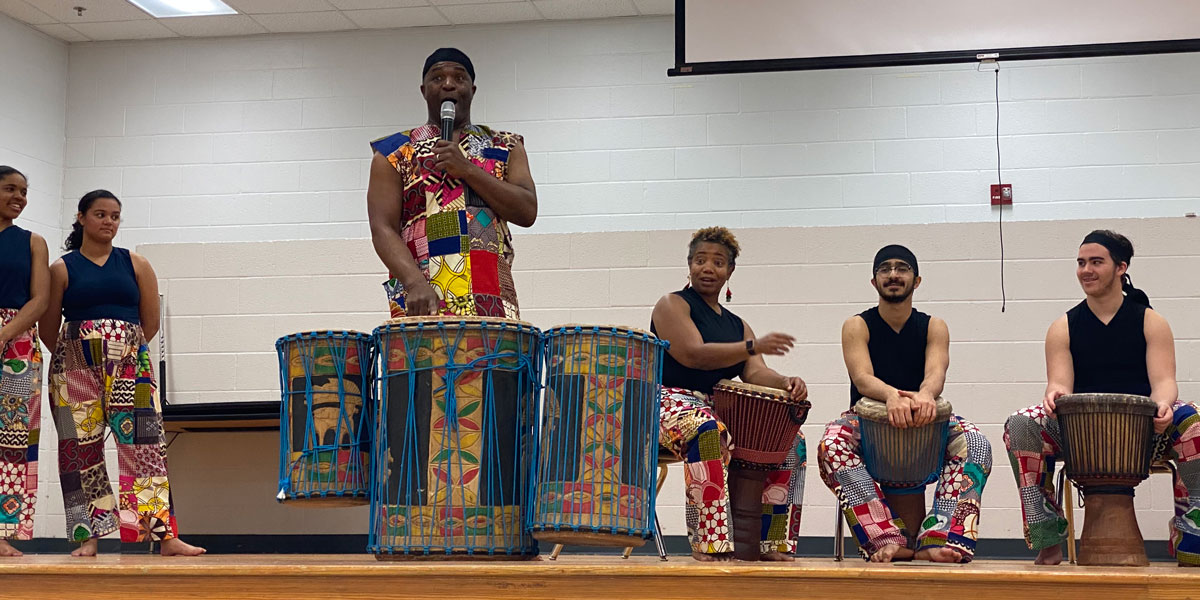 Sherone Price and ensemble perform for students