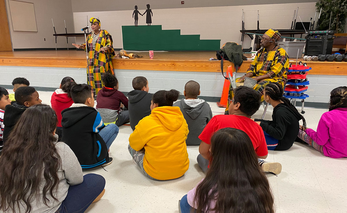 Husband and wife authors and storytellers, Patsie Stepney and John Stepney, talk to the fourth-grade class.