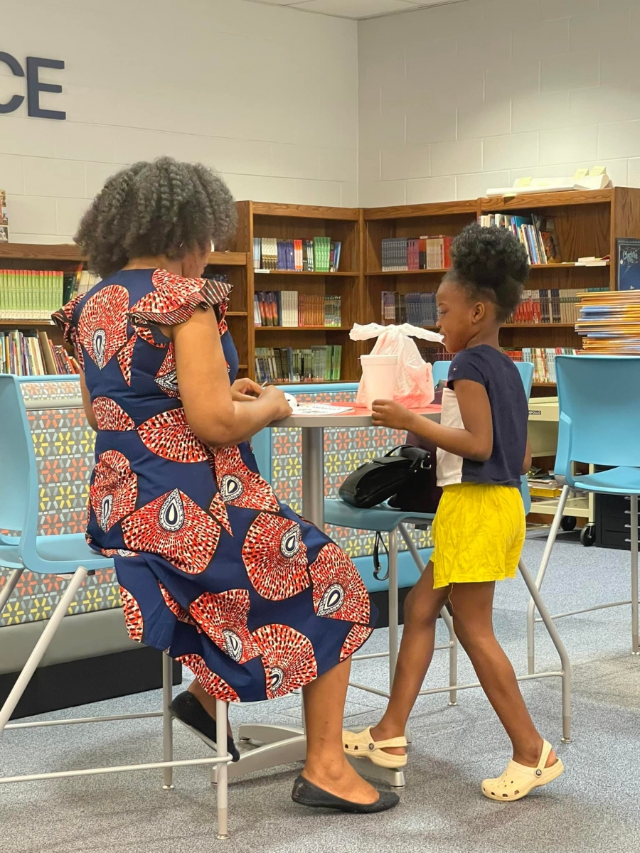 Lyons signing books