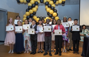 A group of fifth grade graduates of the Appalachian State University Academy at Middle Fork in Walkertown display the HIKE (honesty, integrity, kindness and excellence) awards they received at the academy’s graduation ceremony held Thursday, June 6. Photo by Troy Tuttle