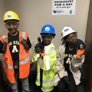 By engaging in Appalachian’s Picture Yourself as a Geologist (PYES) outreach program, students at the Appalachian State University Academy at Middle Fork learn about careers in geoscience. The students pictured here are wearing safety gear used by geologists. Photo submitted