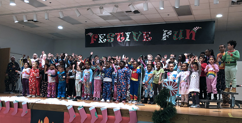 The Academy's kindergarten and 1st-grade students dance and sing during the first Fun Festive Program. Photo submitted