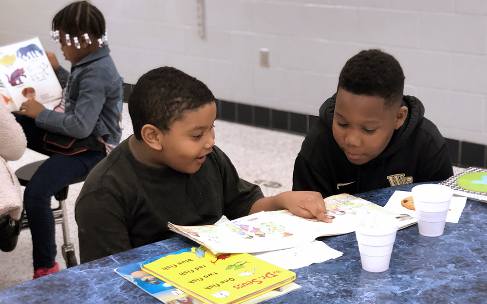 Adrian Haney (4th-grade) and Jhoan Mendez-Candela (1st-grade) read together during Spirit Week's Books and Buddies. Photo submitted