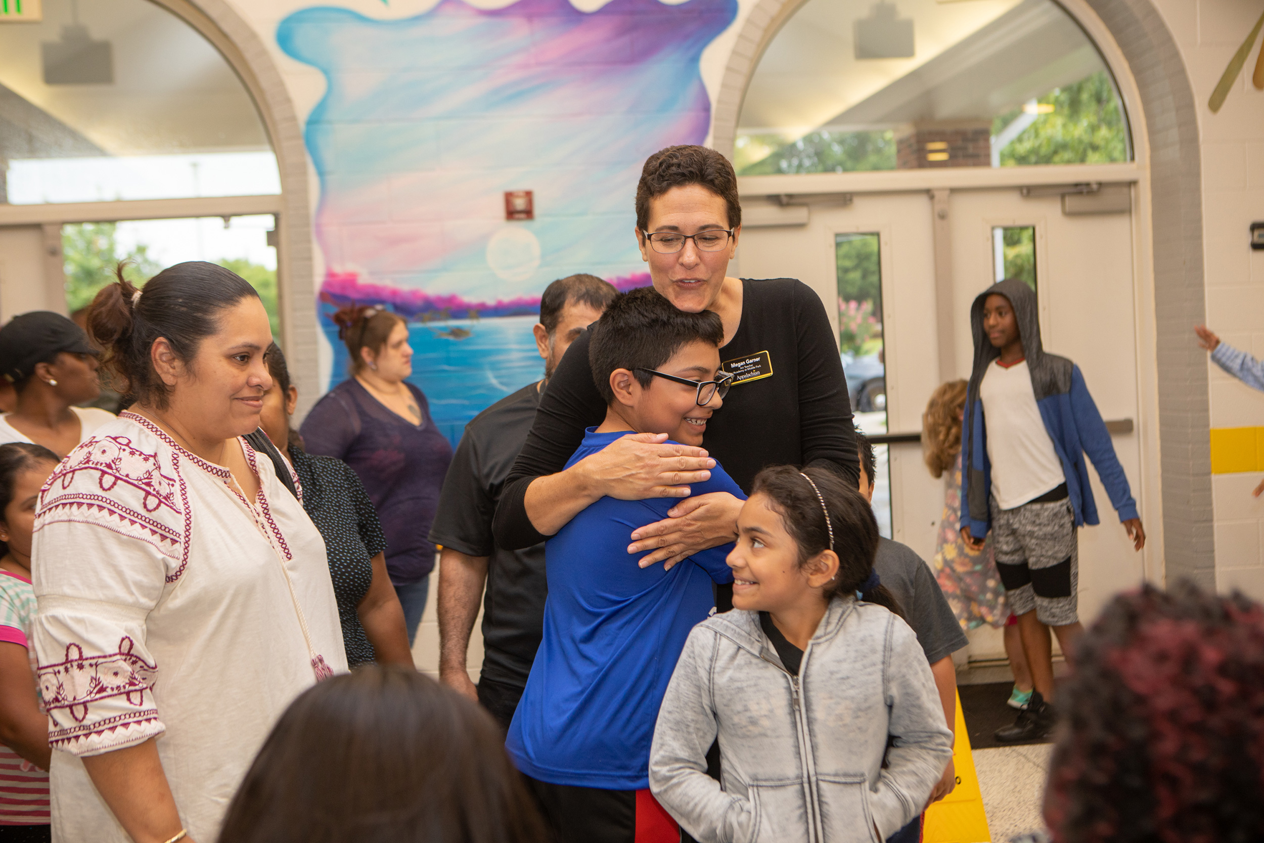 Teacher and student embracing Teacher and student embracing